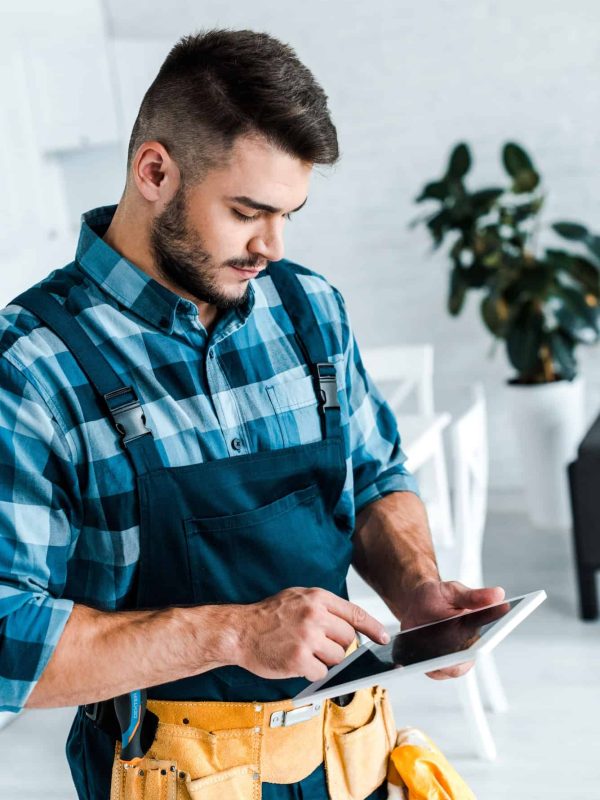 bearded-handyman-pointing-with-finger-at-digital-tablet.jpg bearded-handyman-pointing-with-finger-at-digital-tablet.jpg